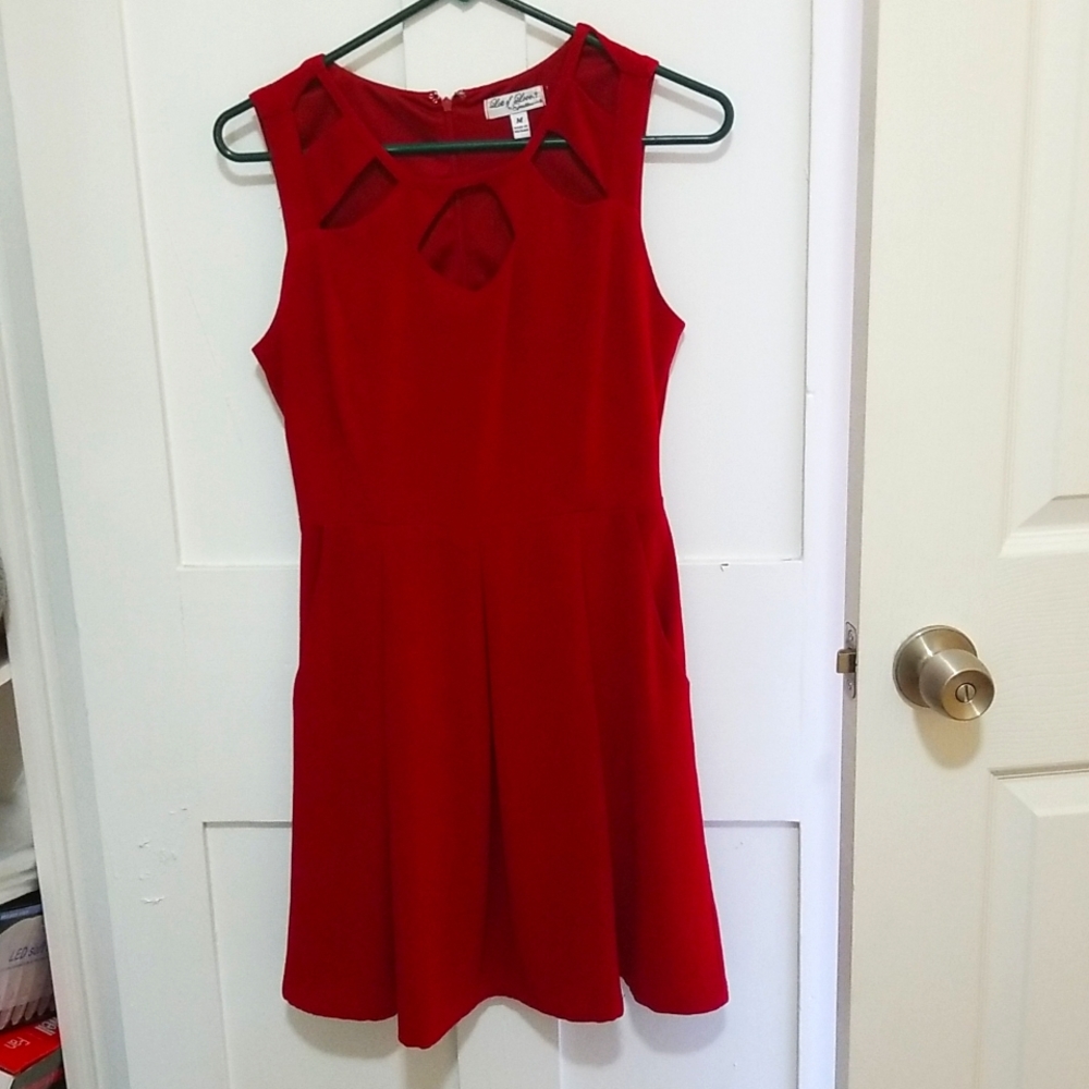 Short red dress with cut outs and pockets
